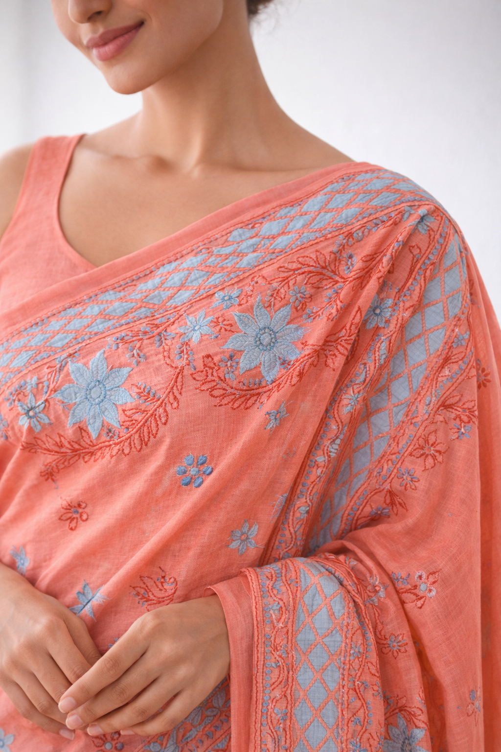 Peach Cotton Chikankari Saree with Sky Blue Floral Embroidery & Elegant Border