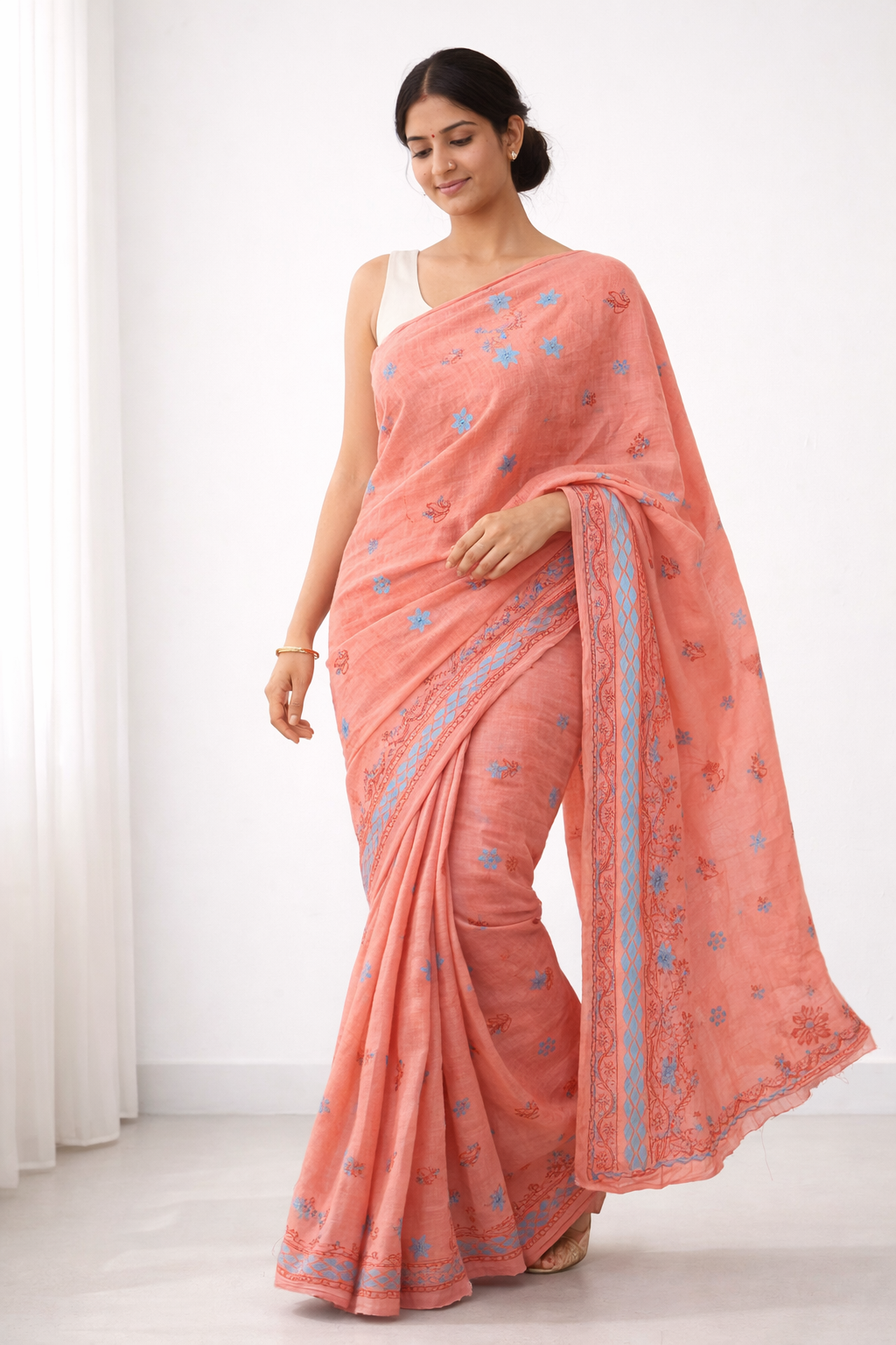 Peach Cotton Chikankari Saree with Sky Blue Floral Embroidery & Elegant Border