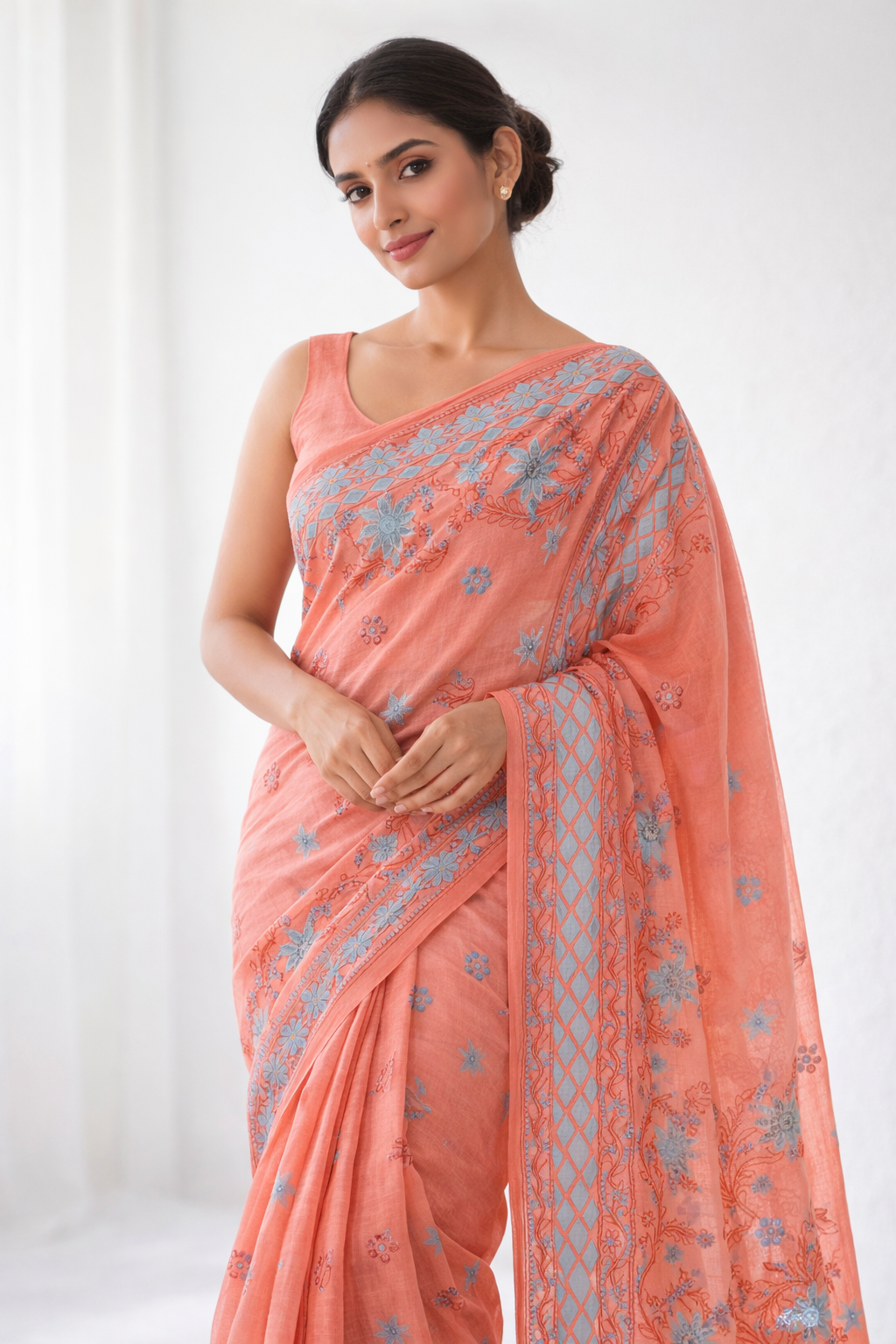 Peach Cotton Chikankari Saree with Sky Blue Floral Embroidery & Elegant Border