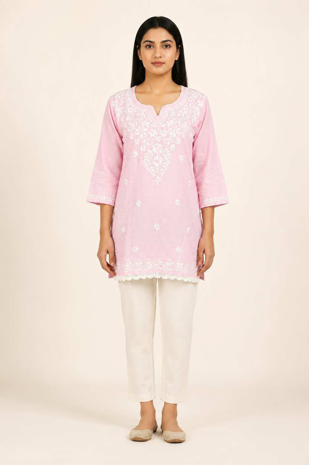Full-length model wearing Baby Pink Modal Chikankari Short Kurti