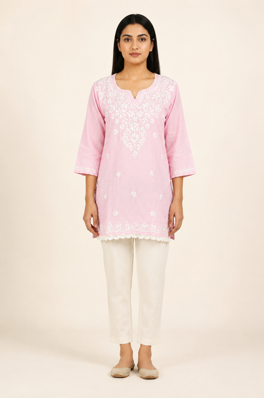 Full-length model wearing Baby Pink Modal Chikankari Short Kurti