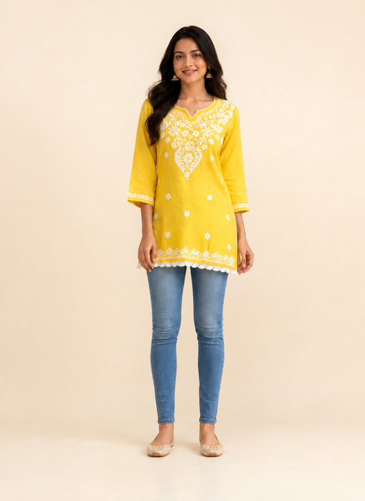 Full-length model wearing Bright Yellow Modal Chikankari Short Kurti with Scalloped Hem