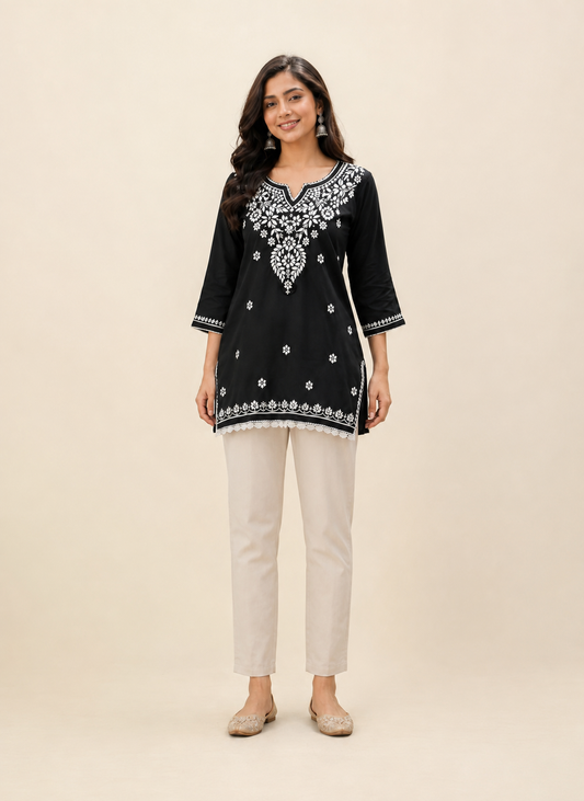 Full-length model wearing Elegant Black Modal Chikankari Short Kurti with Scalloped Hem