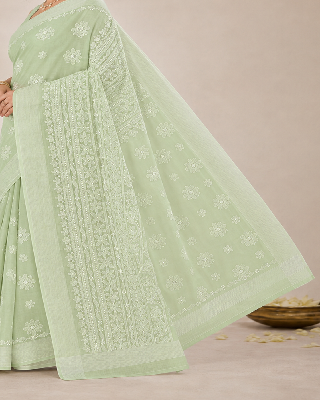 Detailed embroidered pallu and woven border of pista green Chanderi Chikankari saree