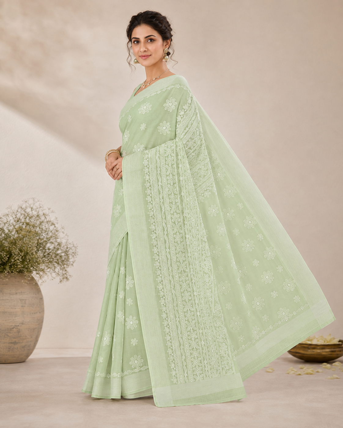 Pista green Chanderi Chikankari saree showing embroidered pallu and border