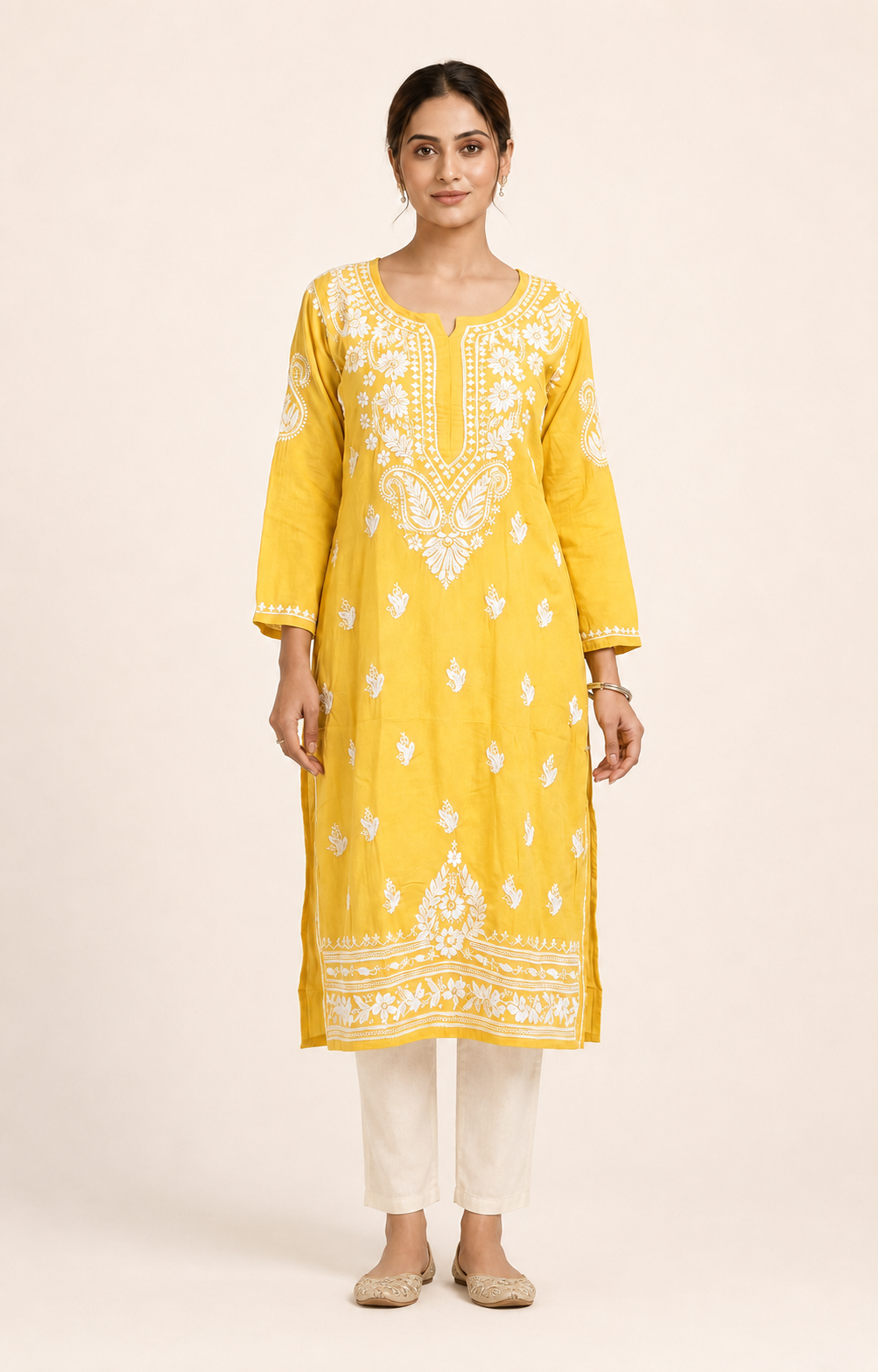 Full-length model wearing Yellow Modal Chikankari Kurti
